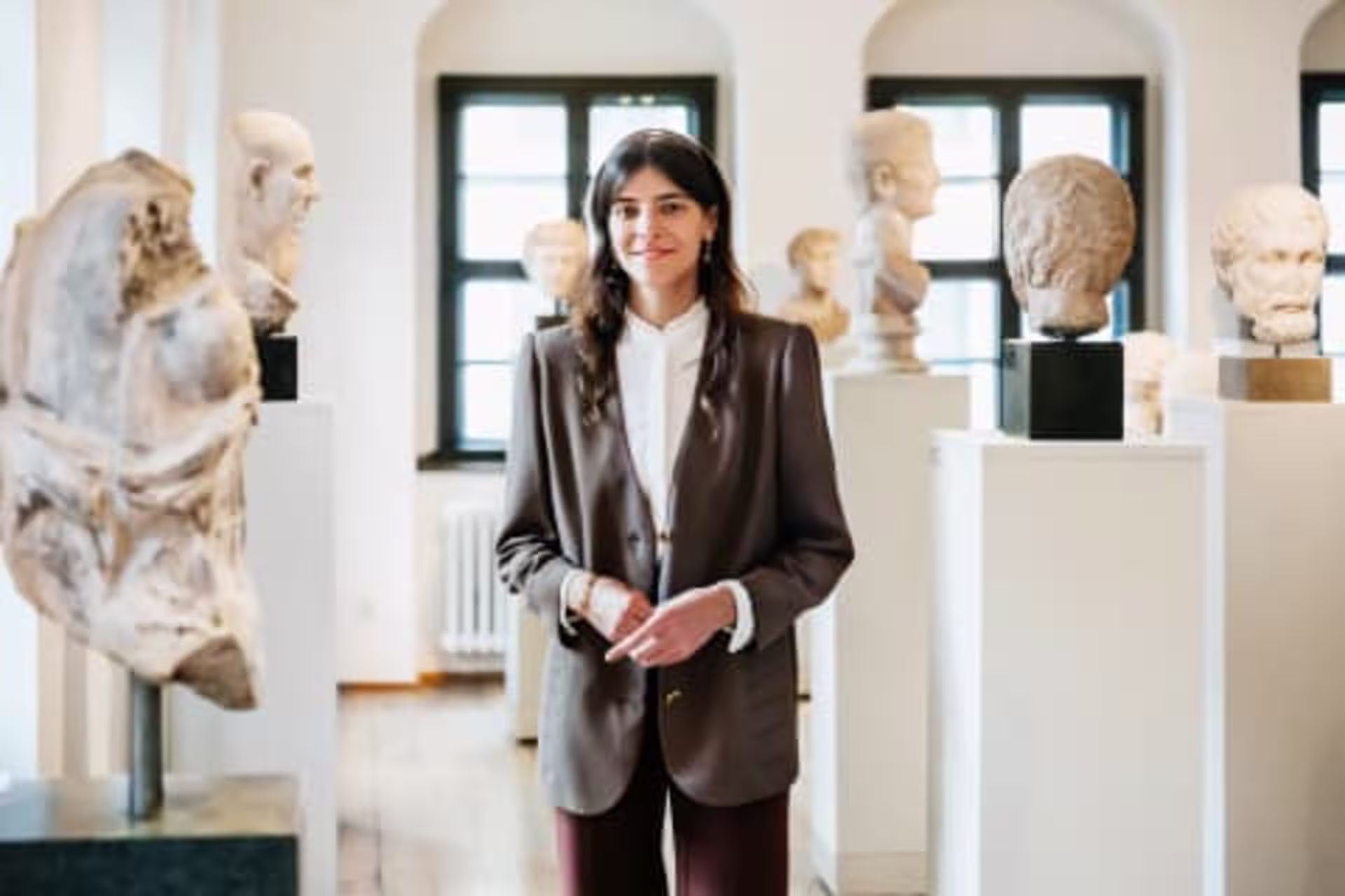 History educator standing in a museum