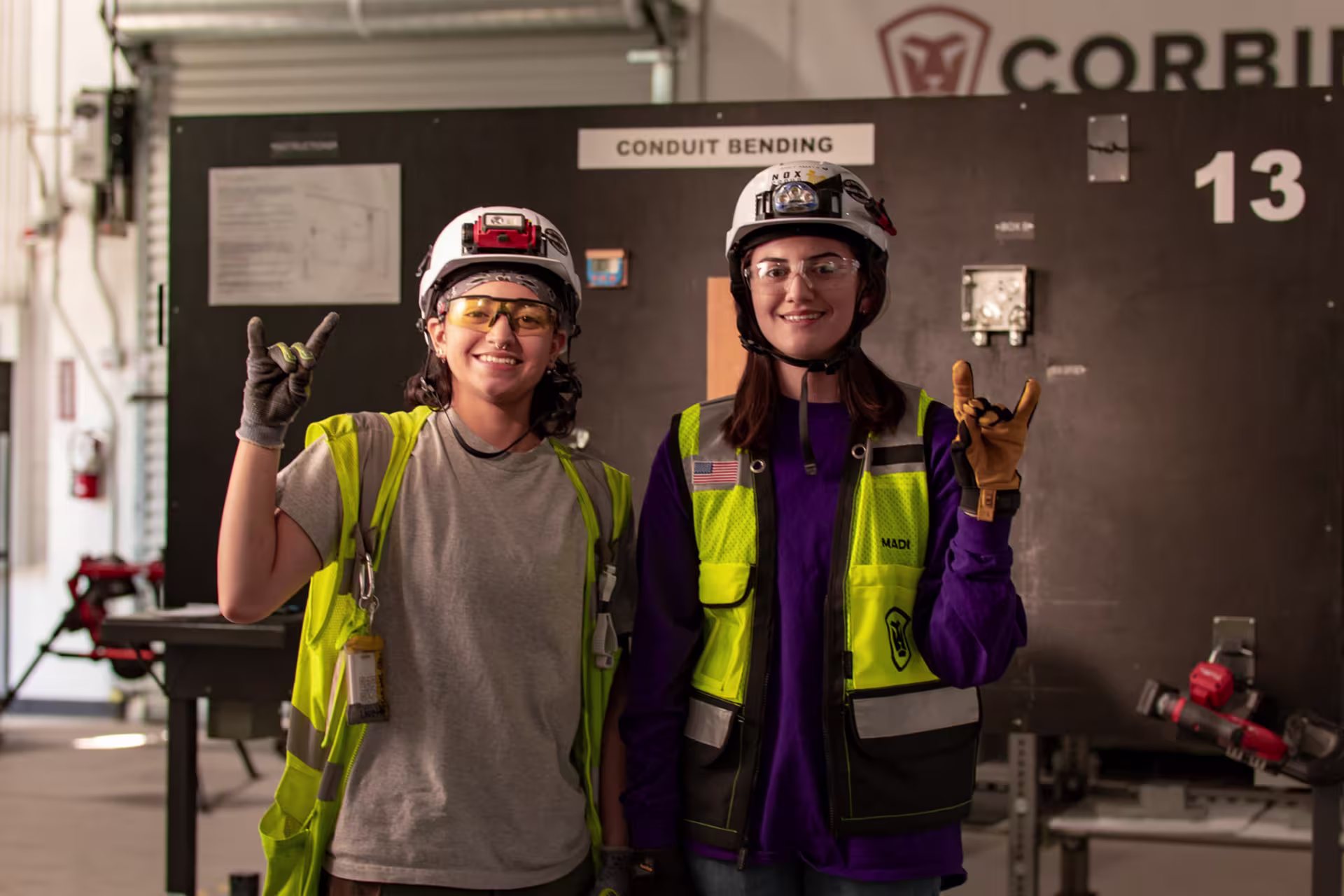 Two female electrician students learning about industrial engineering in the undergraduate certificate program.