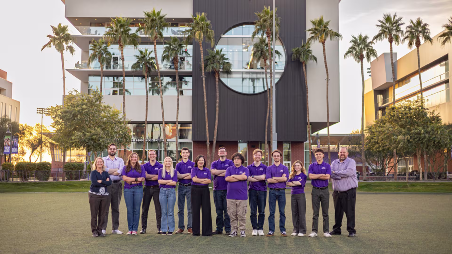 Group shot of the 2025 award-winning GCU speech and debate team near the College of Humanities and Social Sciences building