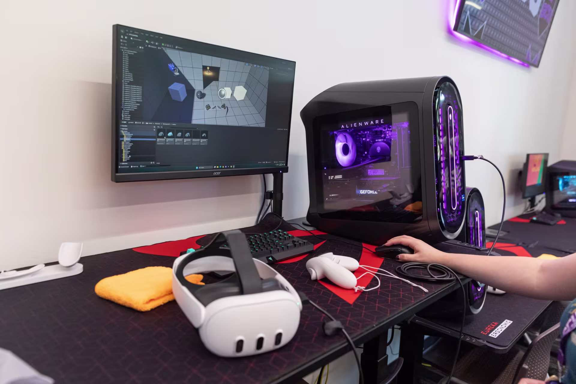 Game designers desk, with a VR headset on it.