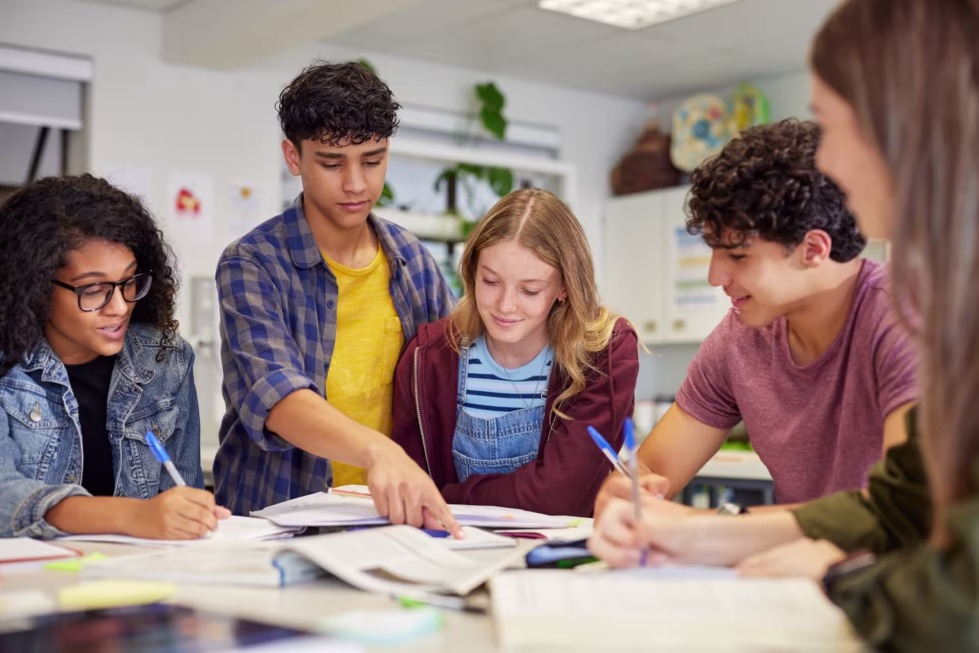 Language degree students engage in a group discussion in a classroom setting.