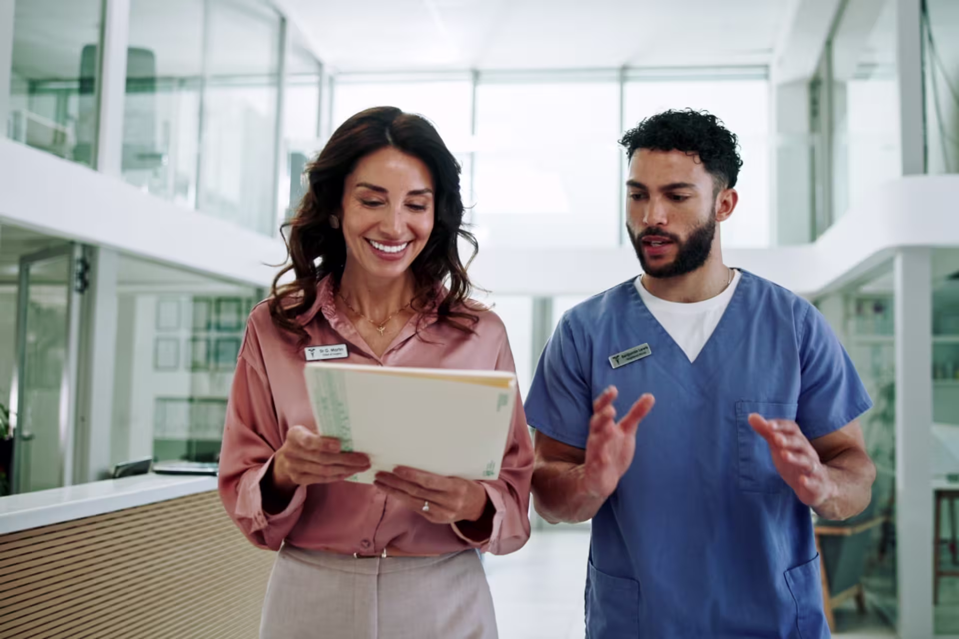 Healthcare professionals discuss their work in a hospital setting.