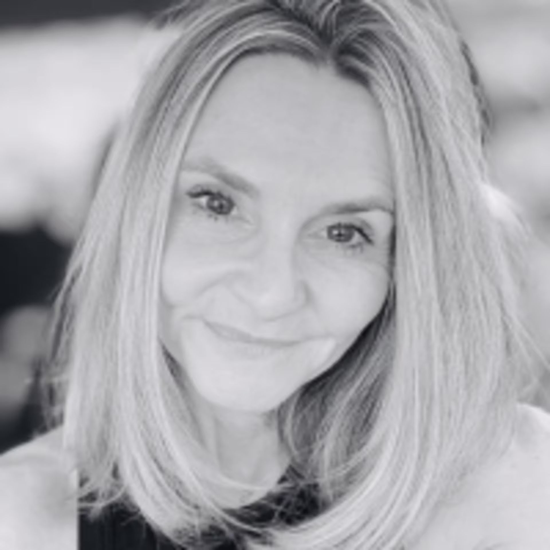 Black-and-white headshot of Dr. Stephanie Knight‑Hay, a senior adjunct faculty member at GCU, looking toward the camera with shoulder‑length hair against a softly blurred background.