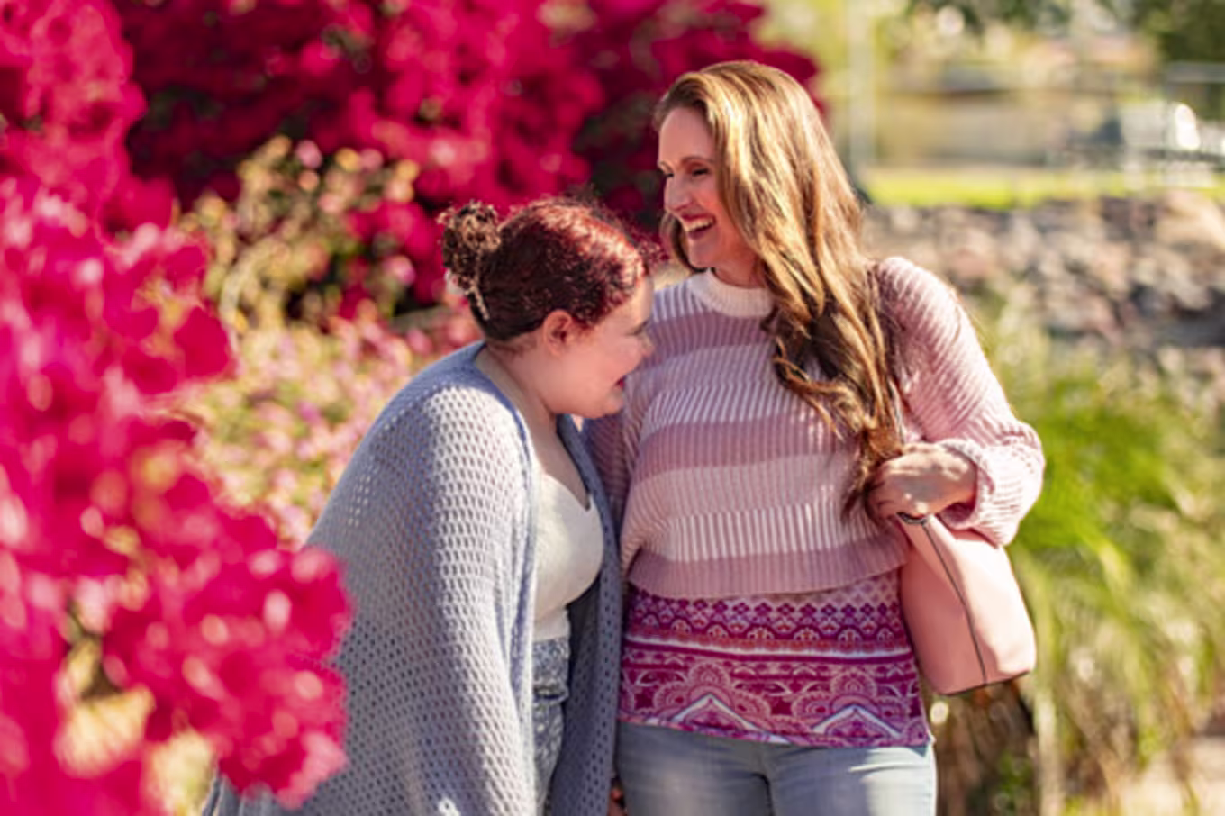2 females laughing outside