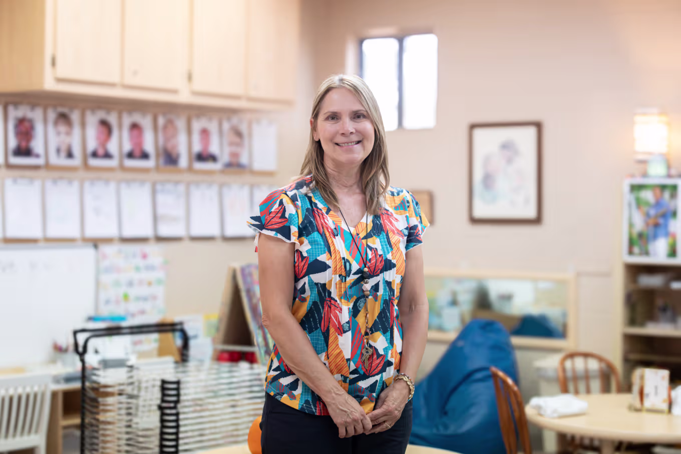 Sociology educator standing and smiling at the camera