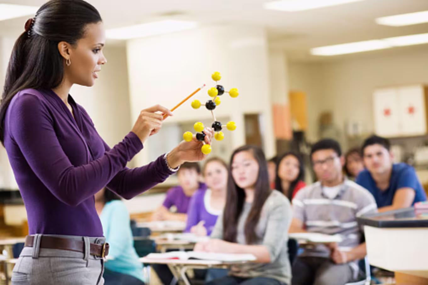 High school teacher giving science lesson