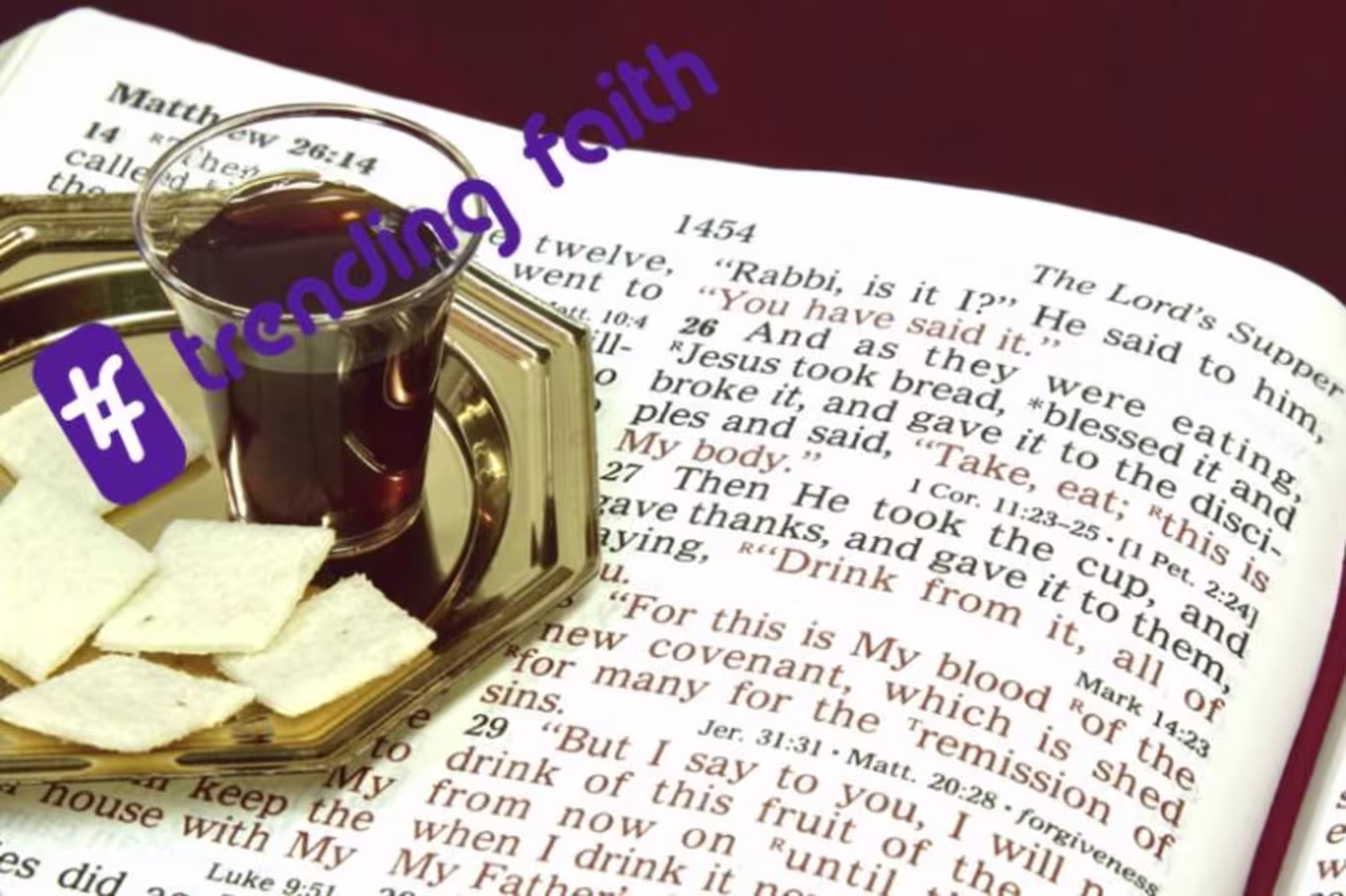 Communion wafers and wine sitting on the Bible with the Trending Faith logo