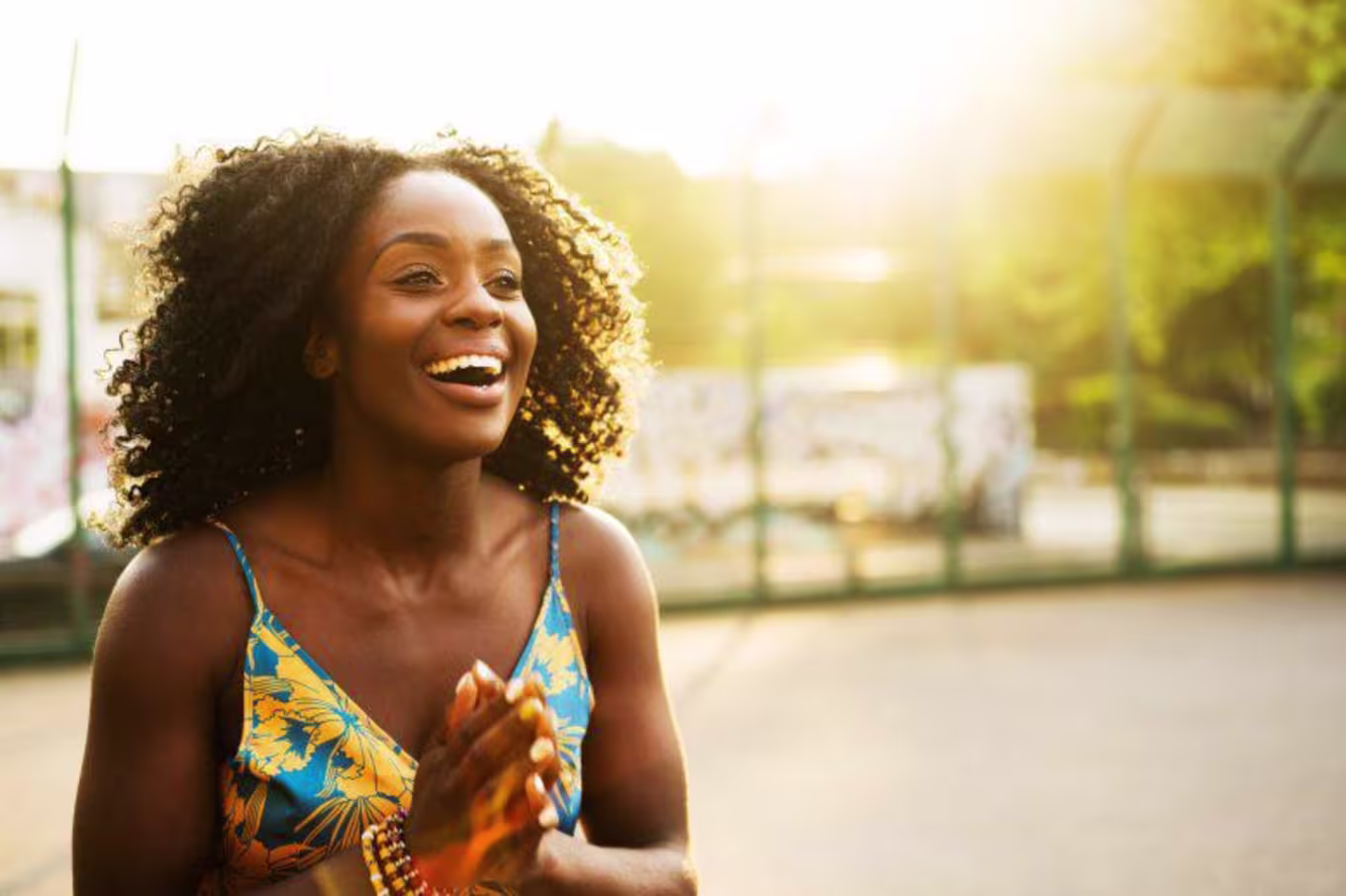 woman smiling and laughing outside