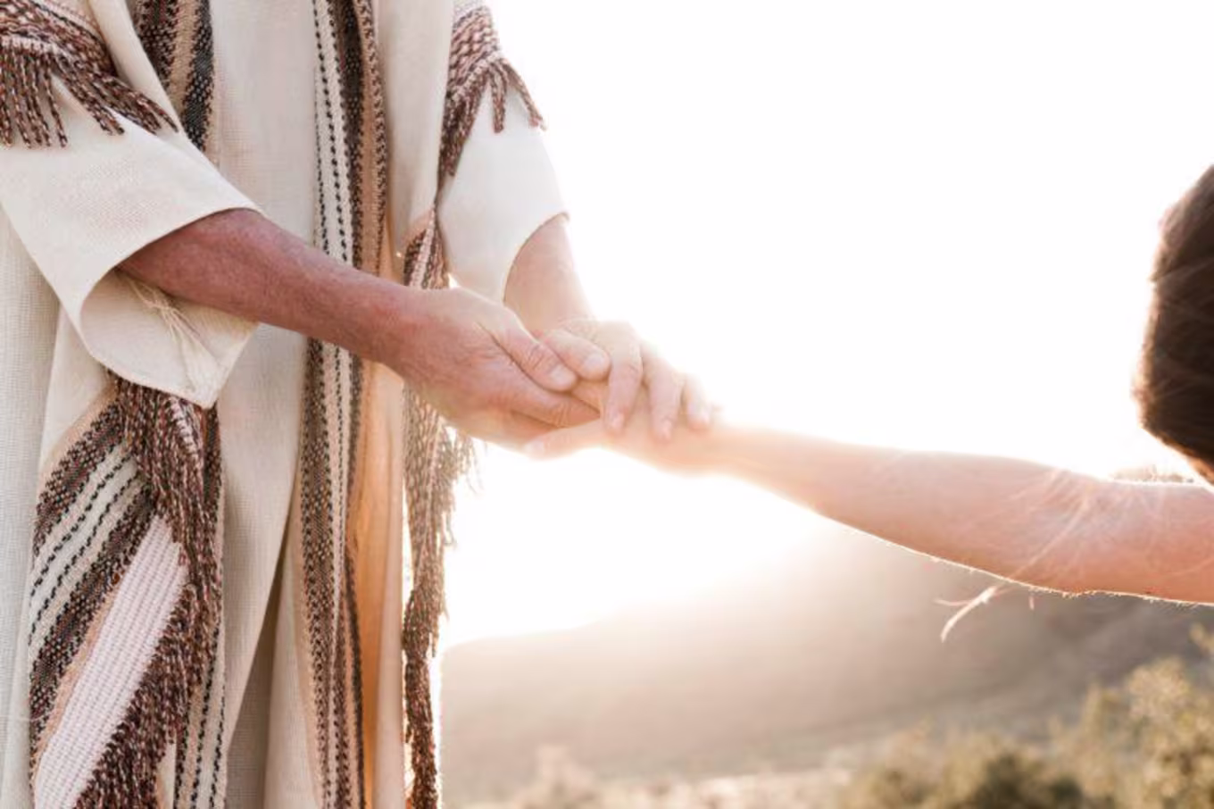 Jesus holding someone's hand