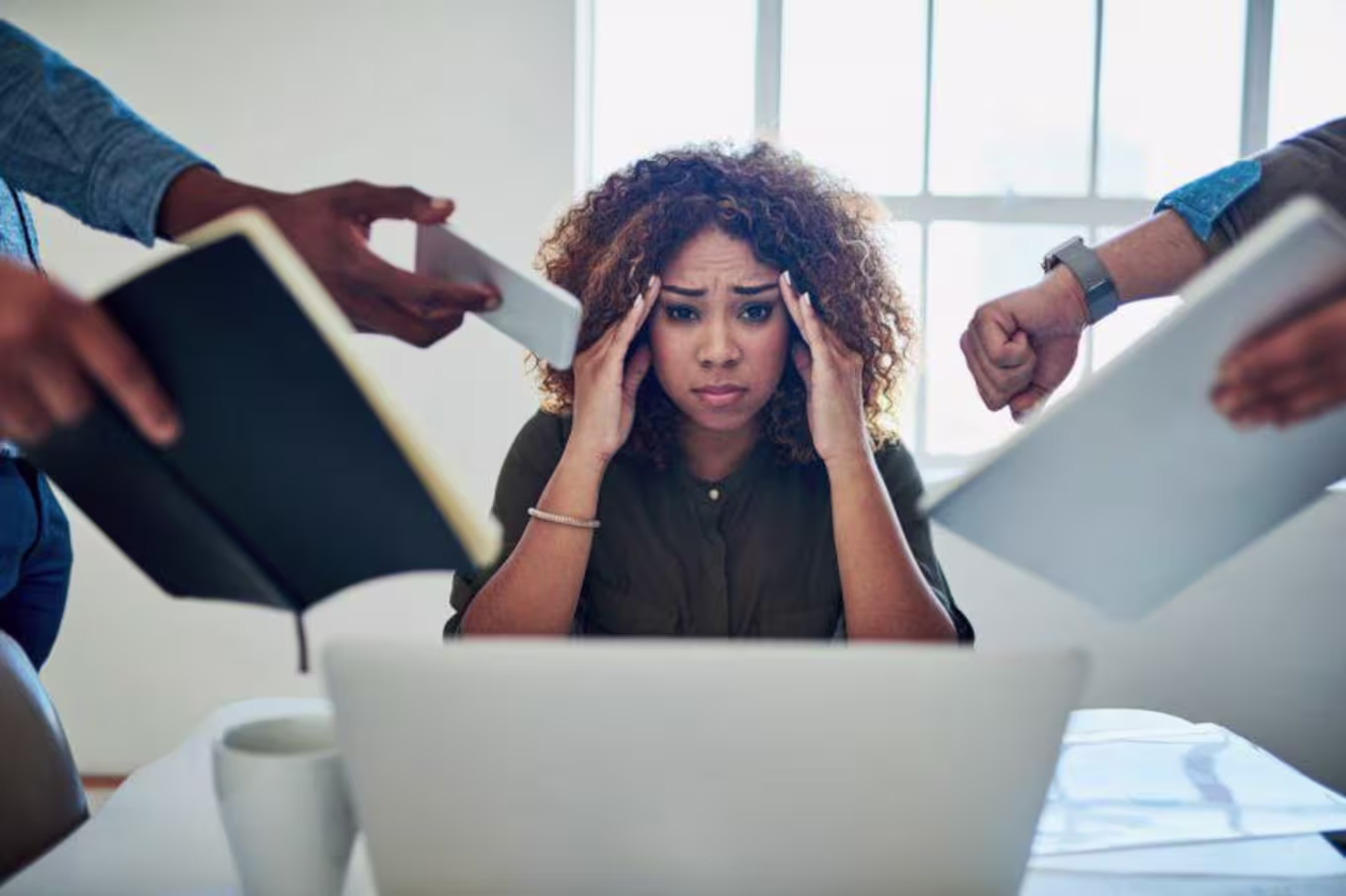 person putting hands on head stressed out