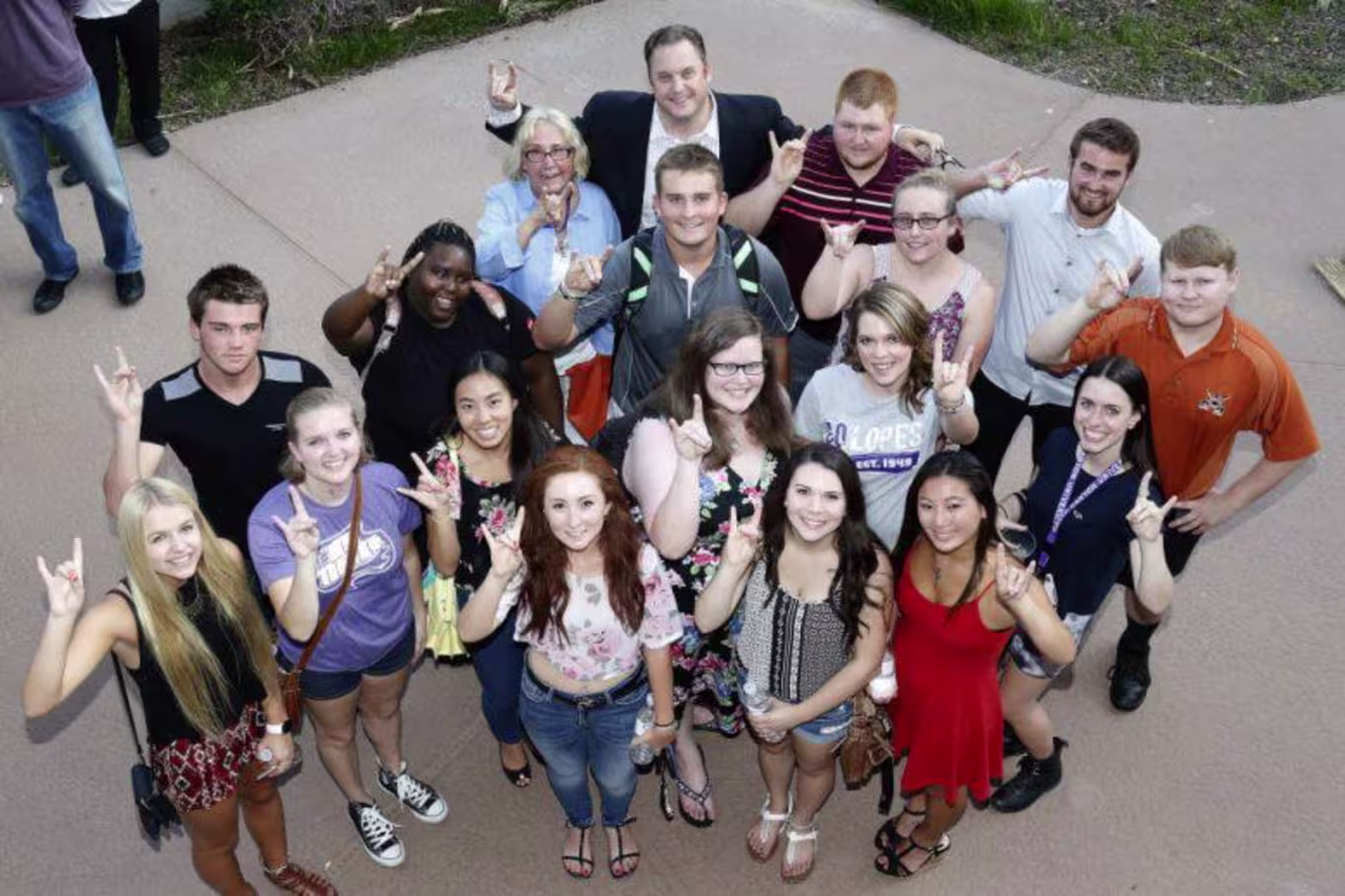 students throwing the Lopes up