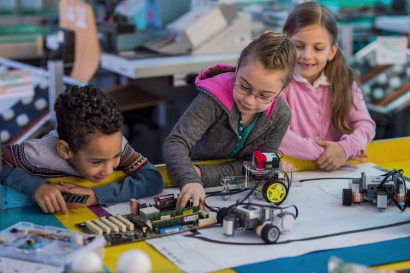 Young children working with robots