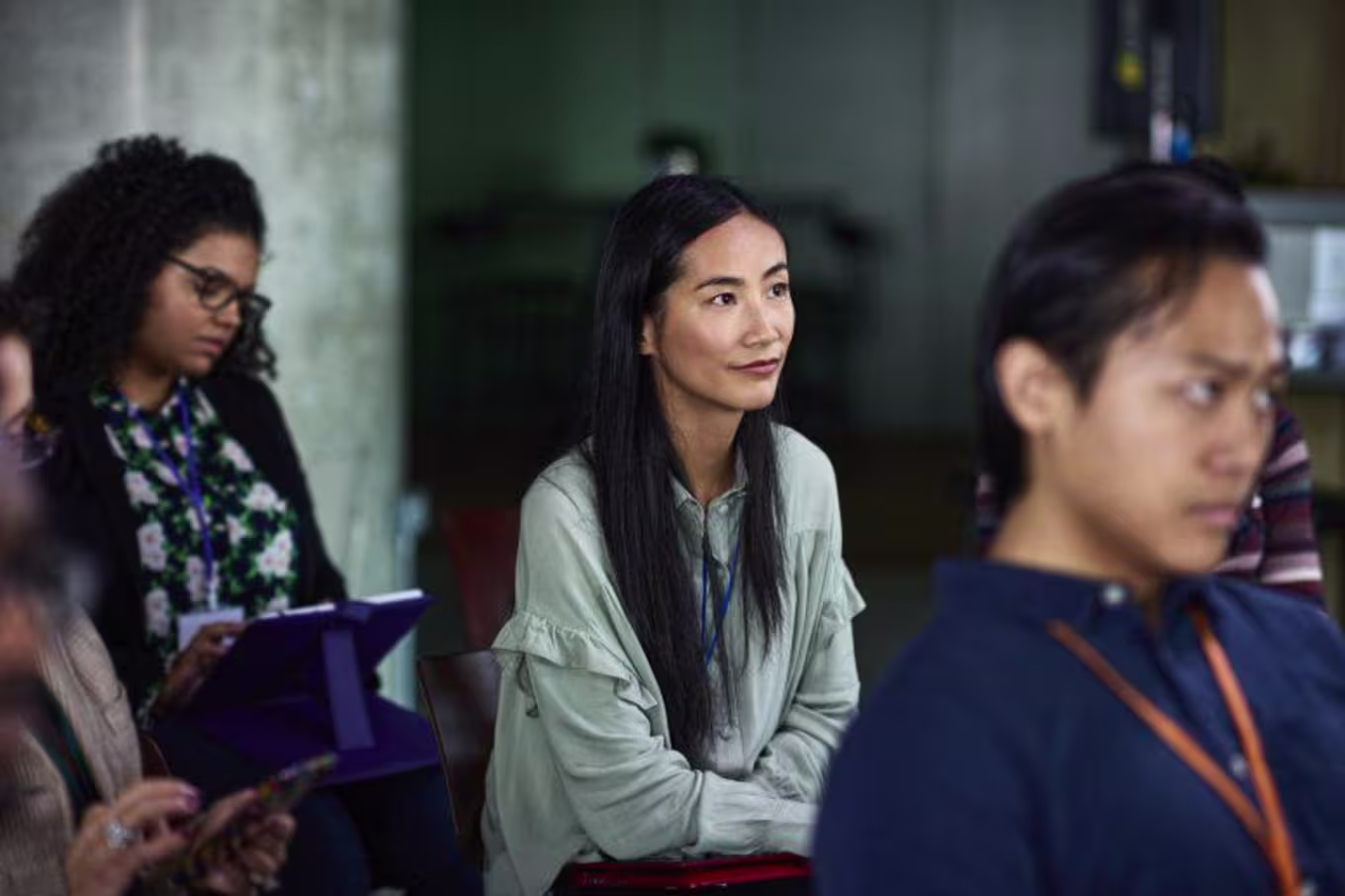 Attentive woman in an audience at a presentation