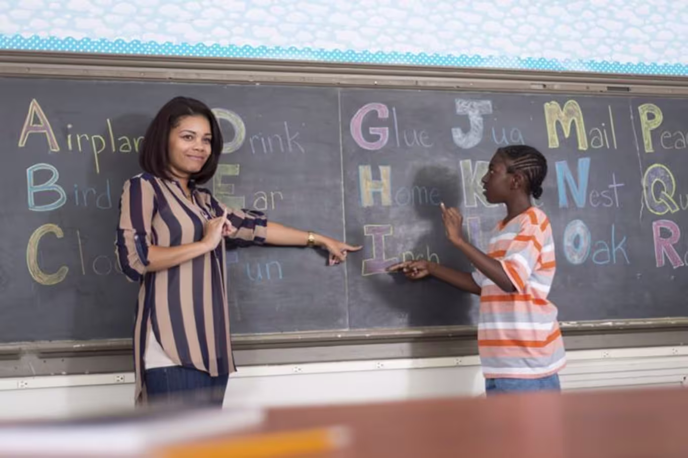 teacher helping a student