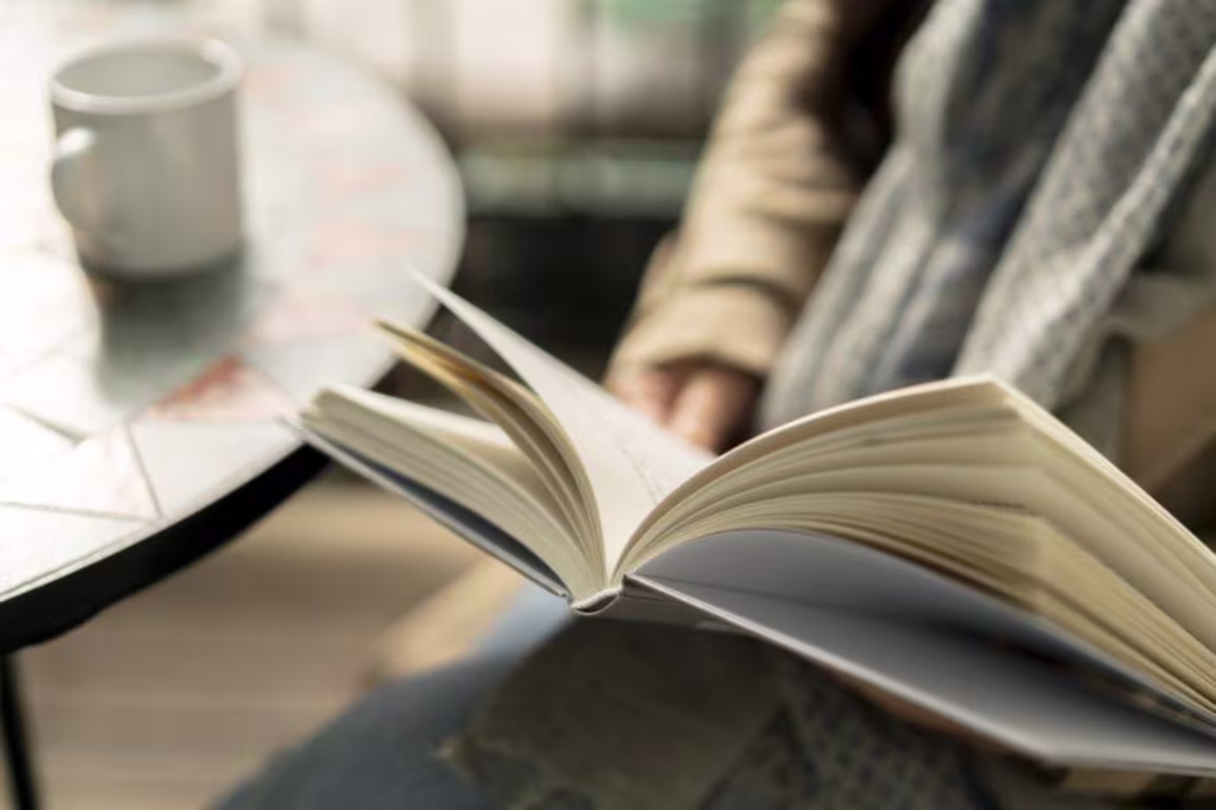 person reading in a coffee shop