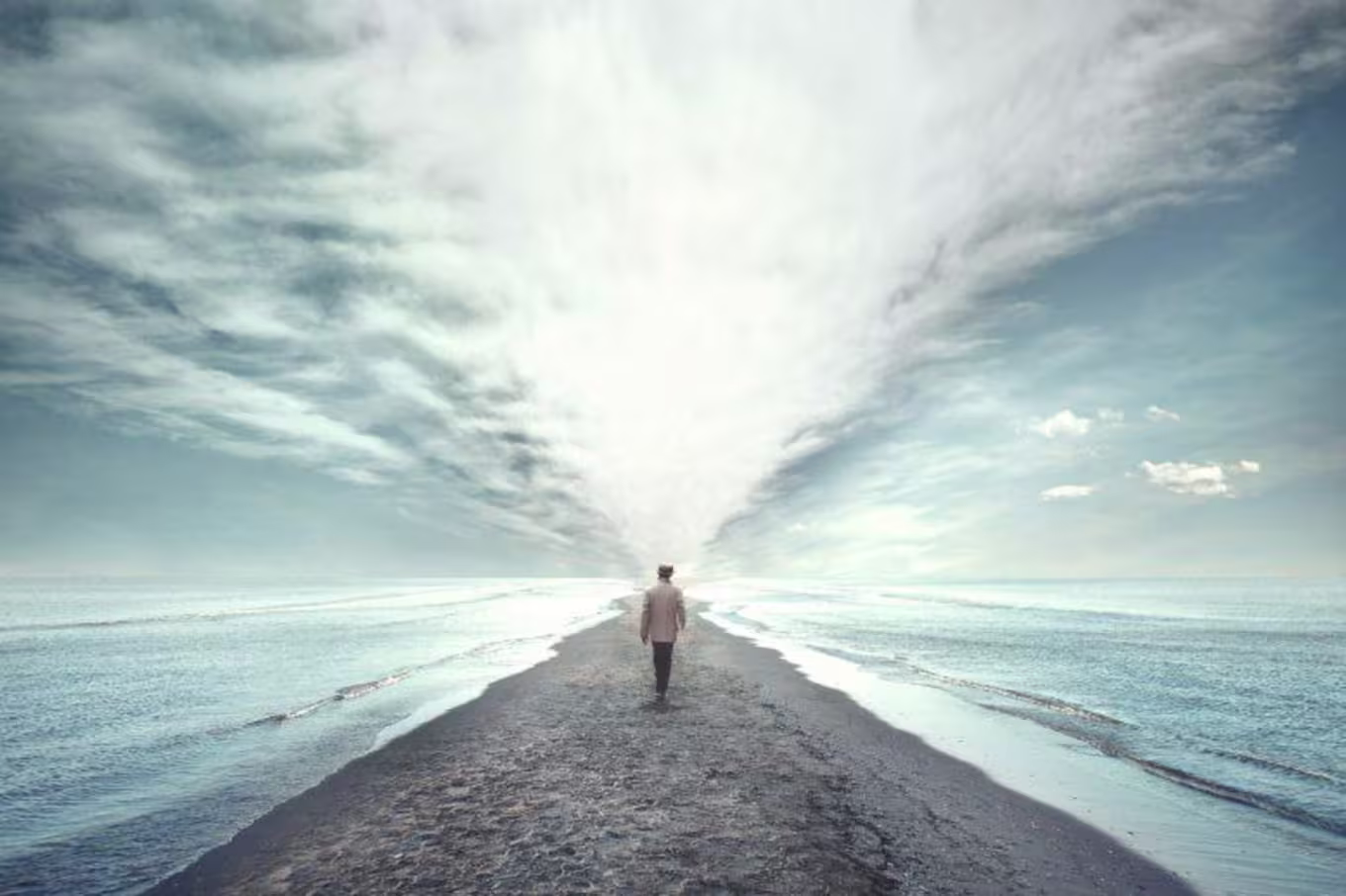 person walking on beach