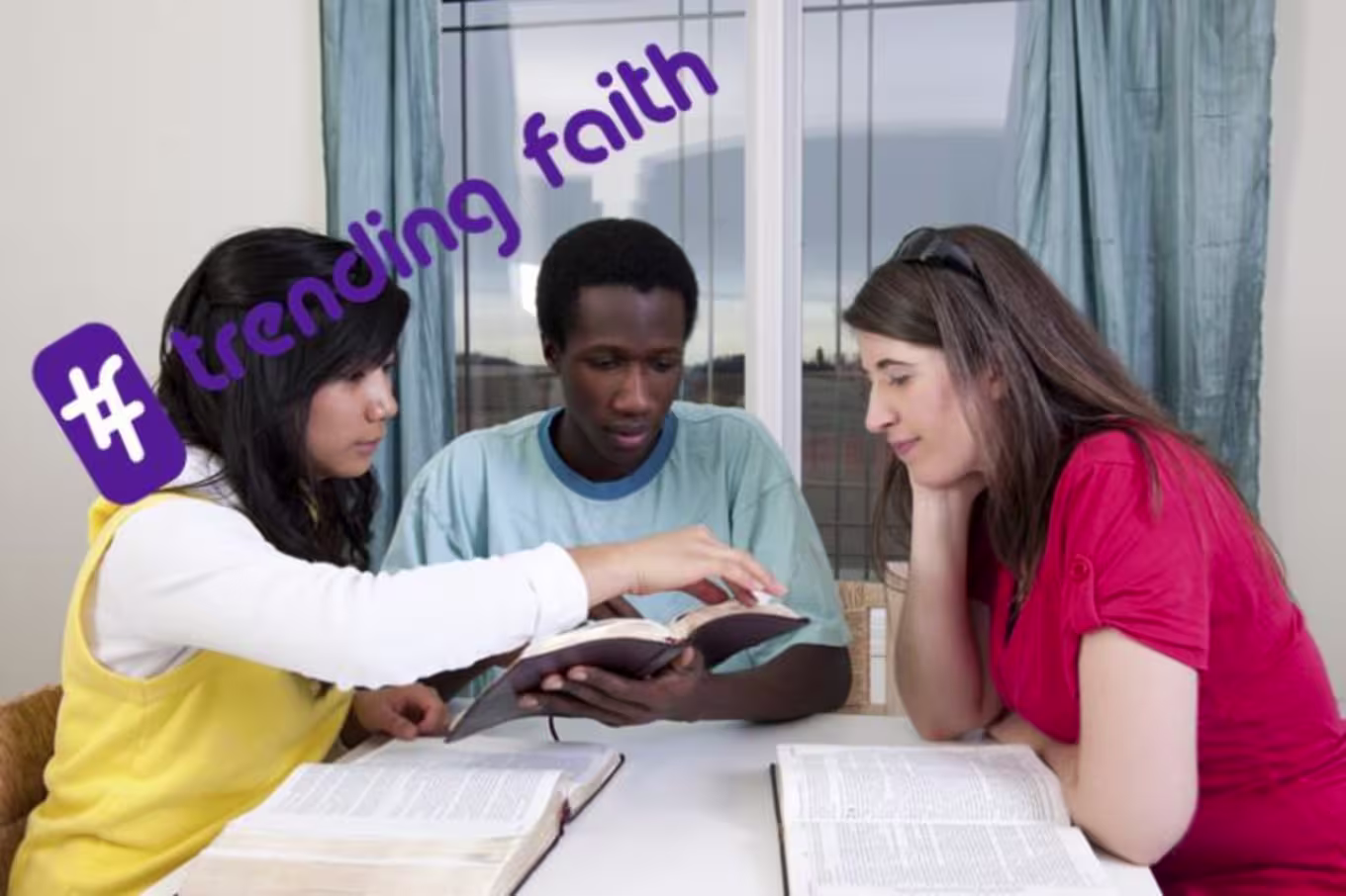A group of people sitting around a table with the trending faith logo