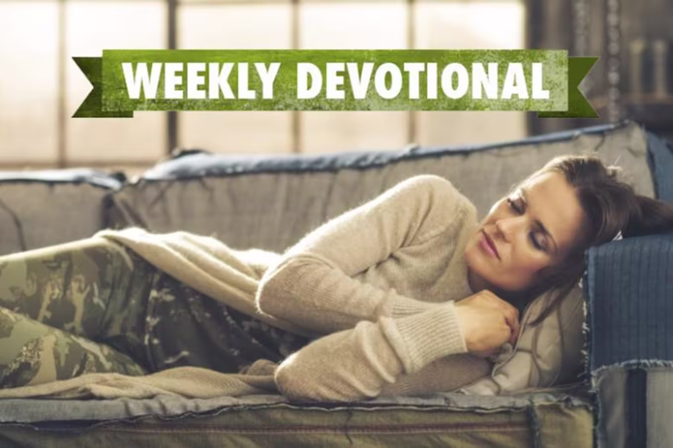 A student sleeping on the couch under a Weekly Devotional banner