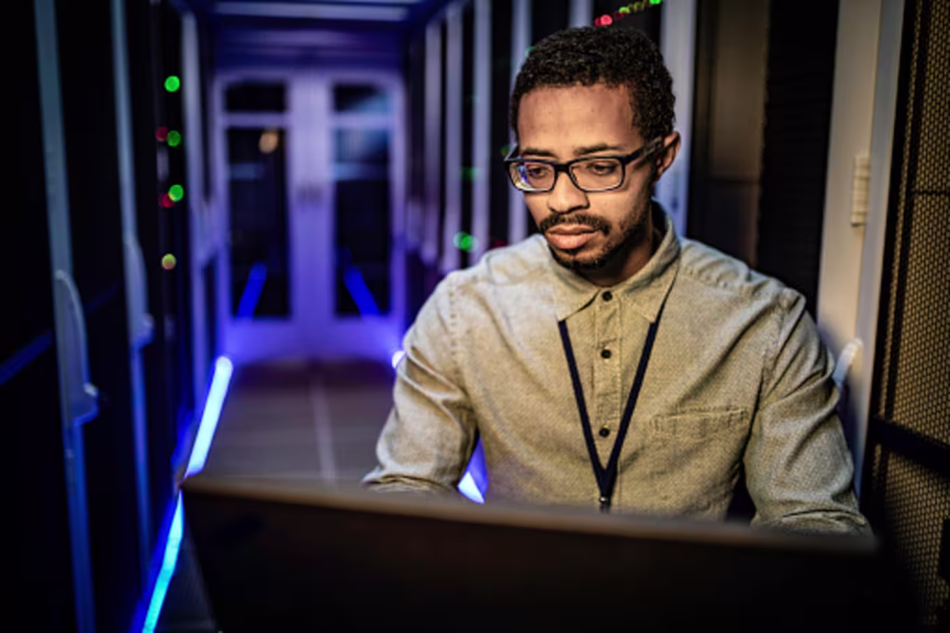 Cybersecurity manager checking system networks in computer lab