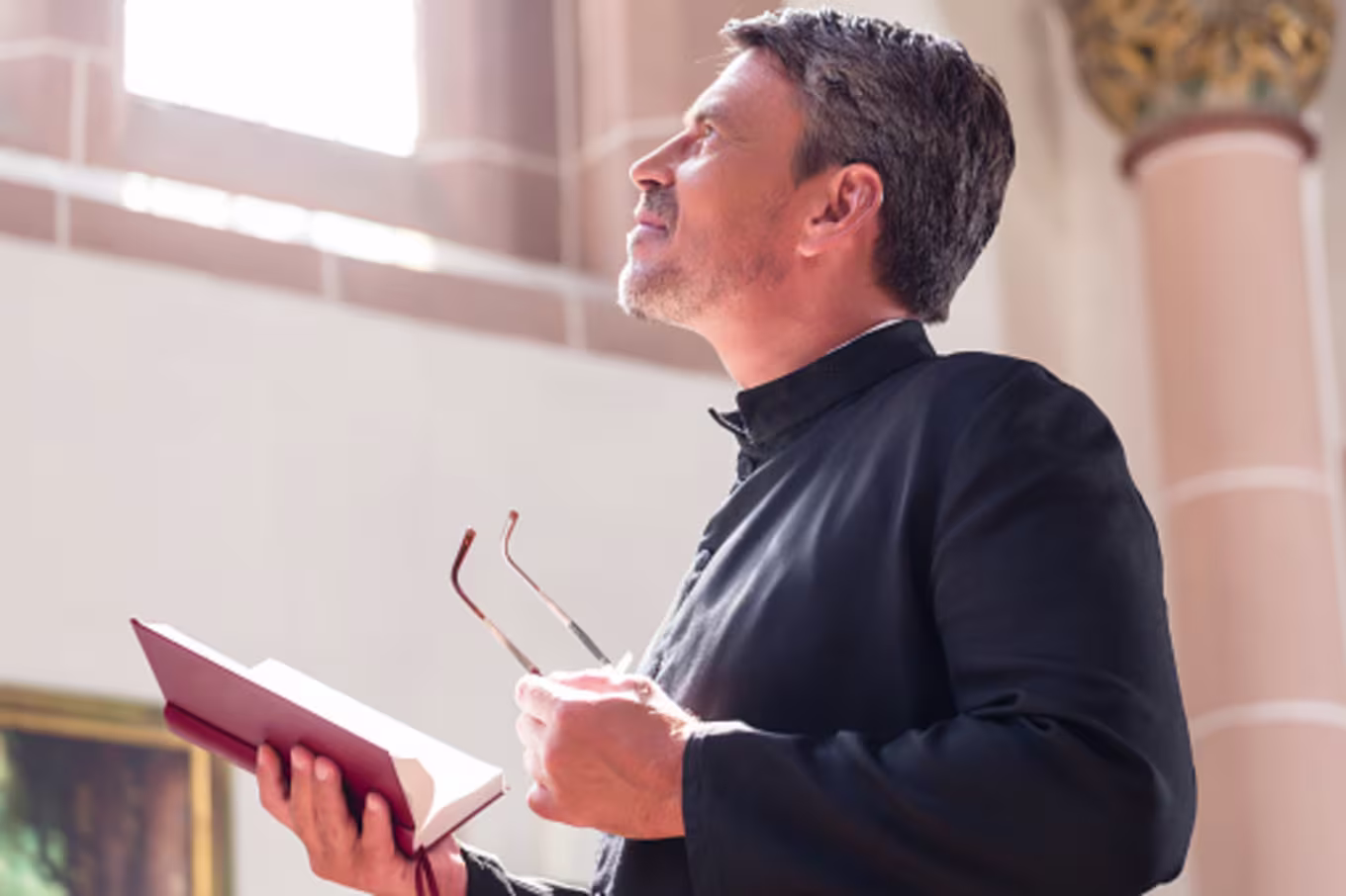 Pastor meditating on God's word at church