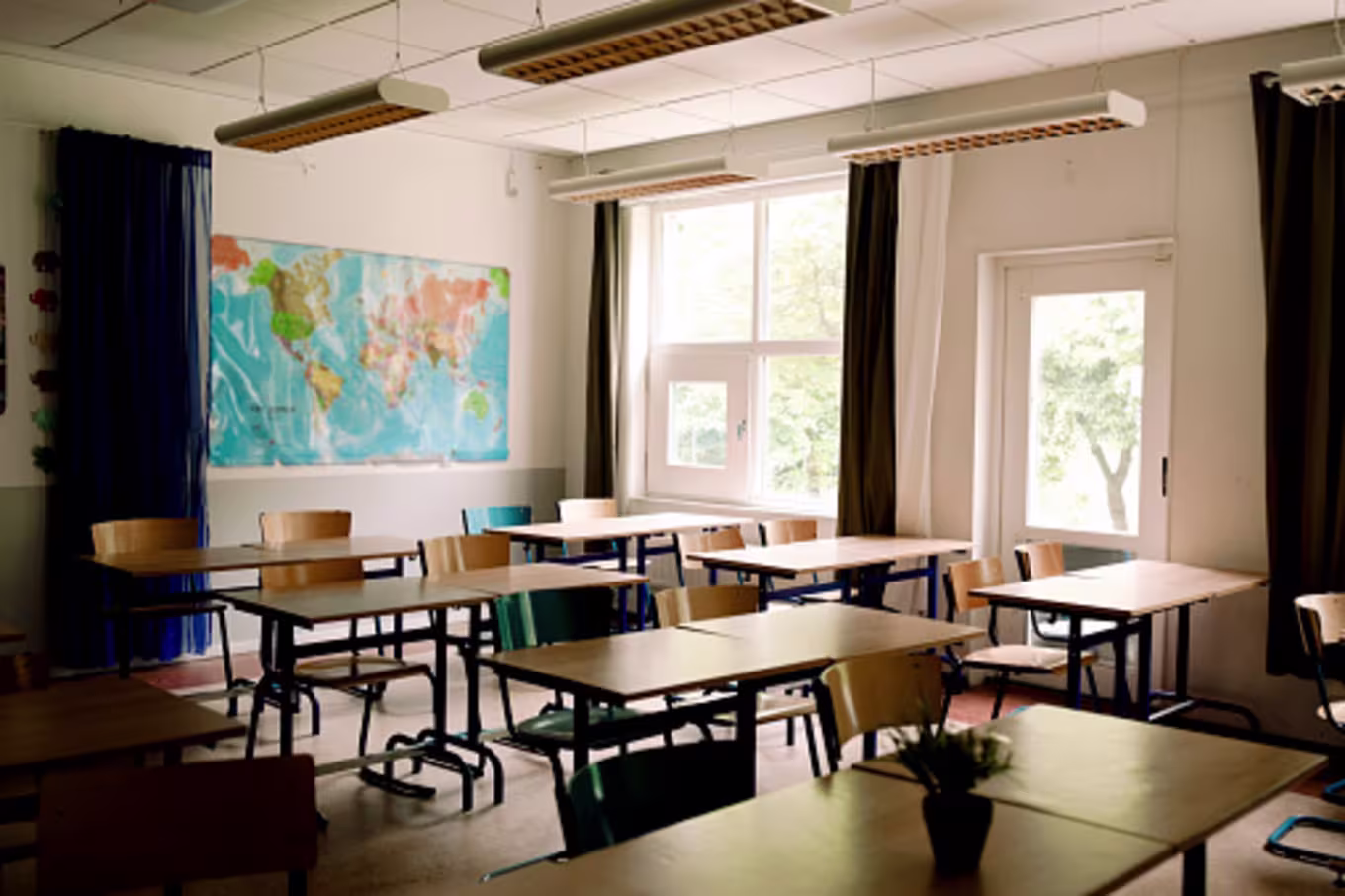 A classroom with desks and chairs