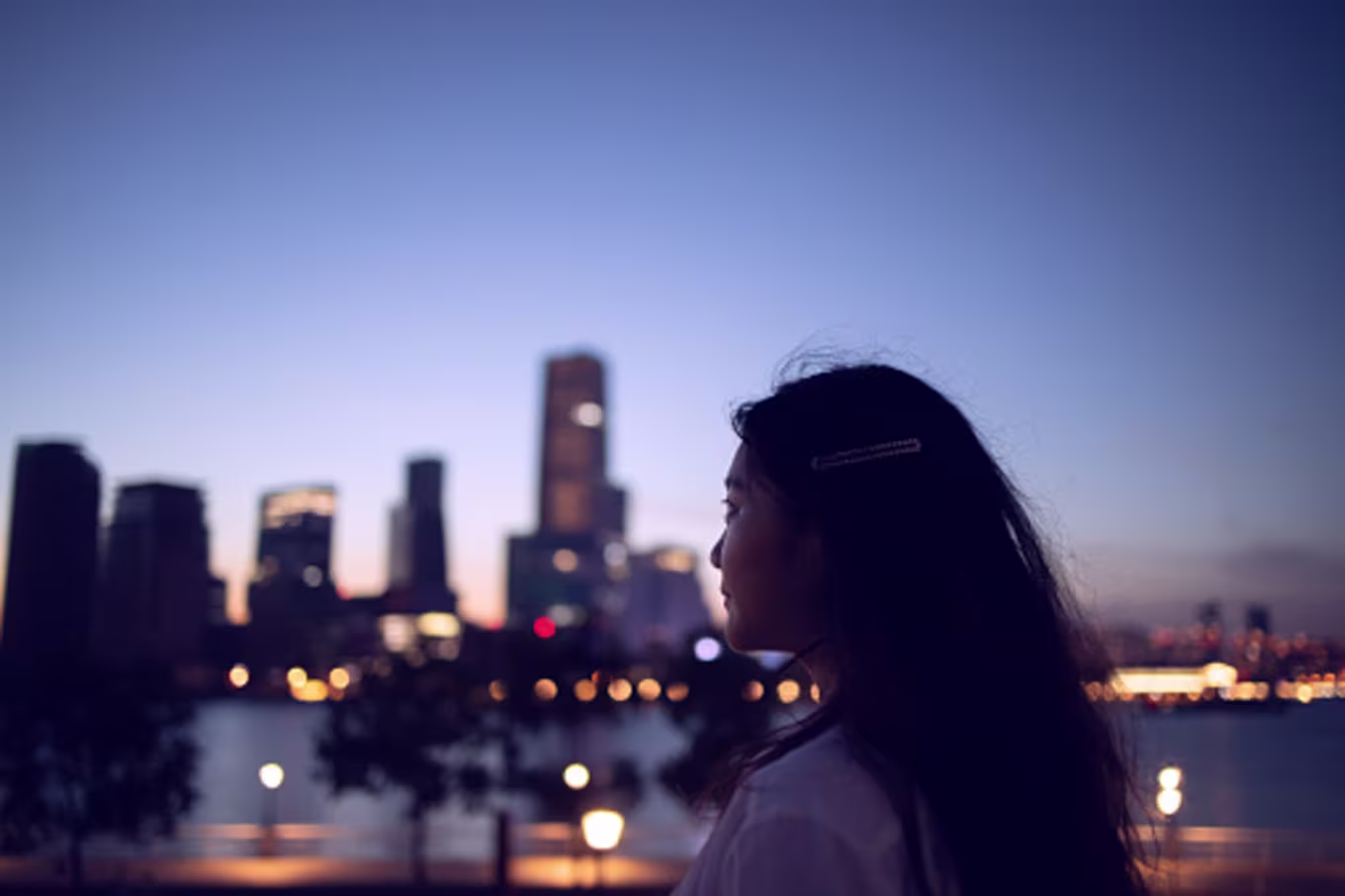Woman looks out over a city