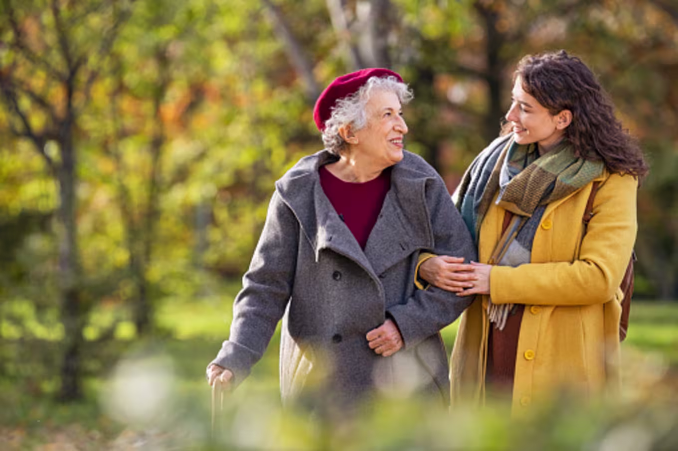 Woman listening to grandmother on walk