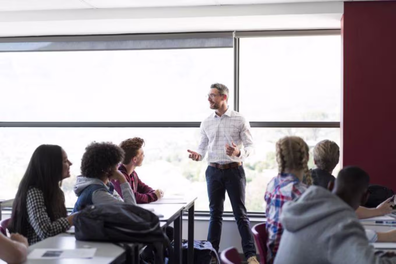 Adult Male Instructor teaches young adults