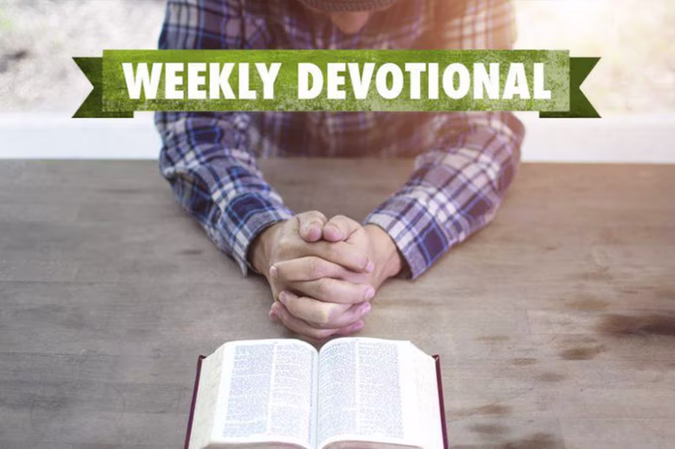 Man praying with Bible