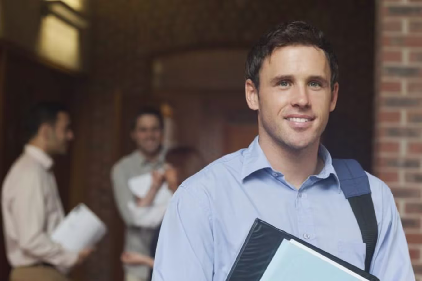 Business student carrying book