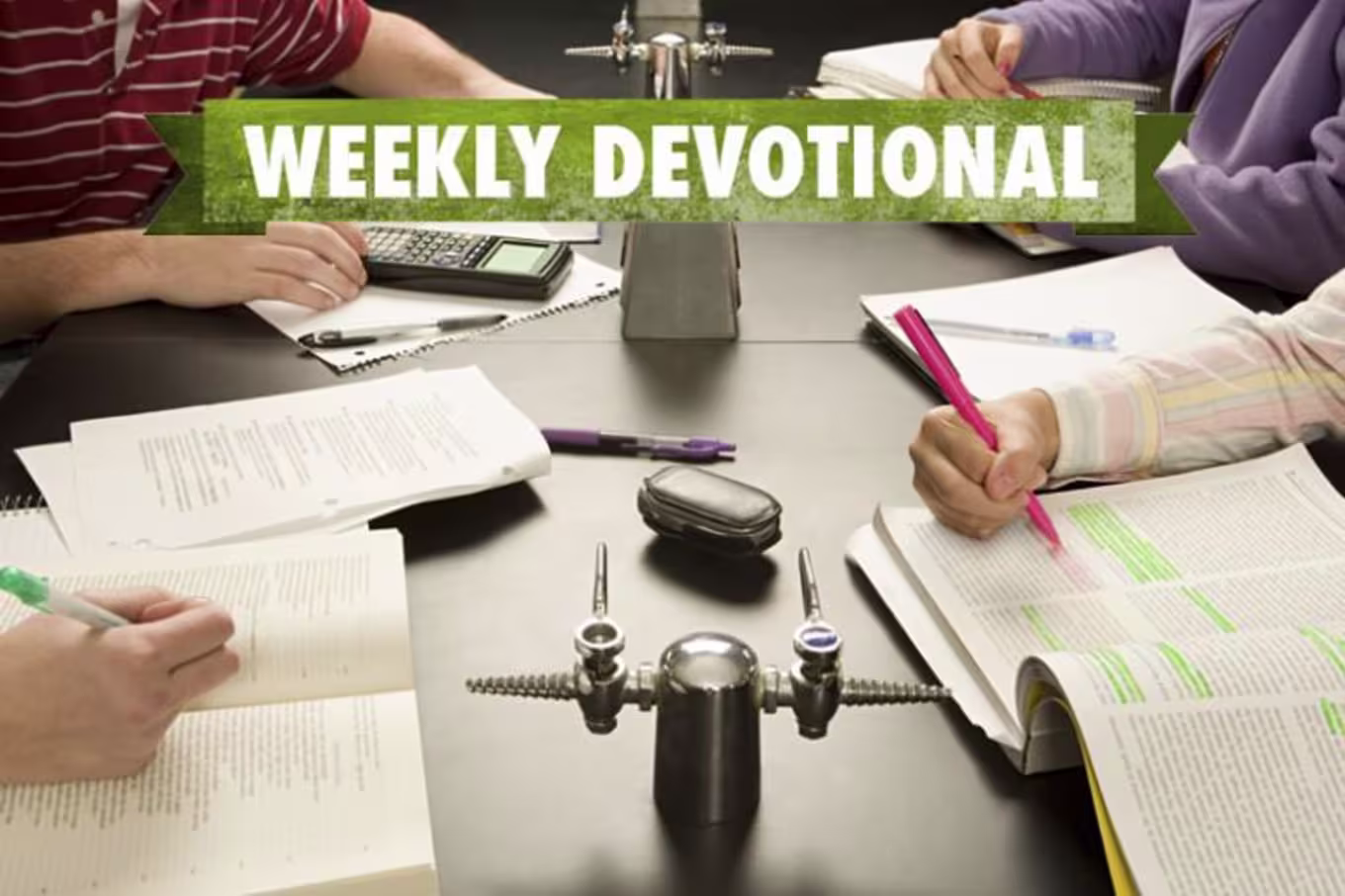 A group of students studying under the Weekly Devotional banner