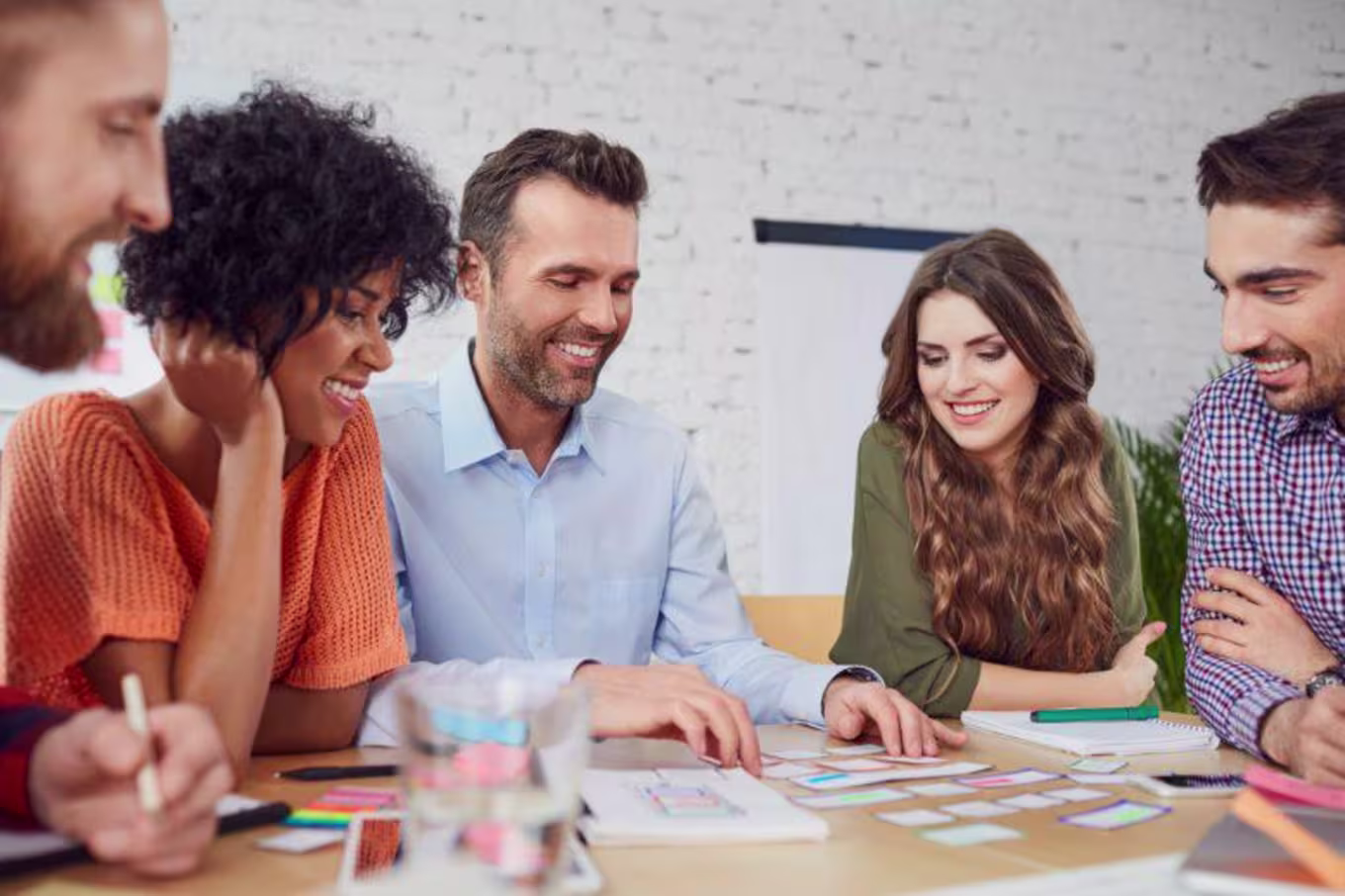 Group of professionals talking and smiling