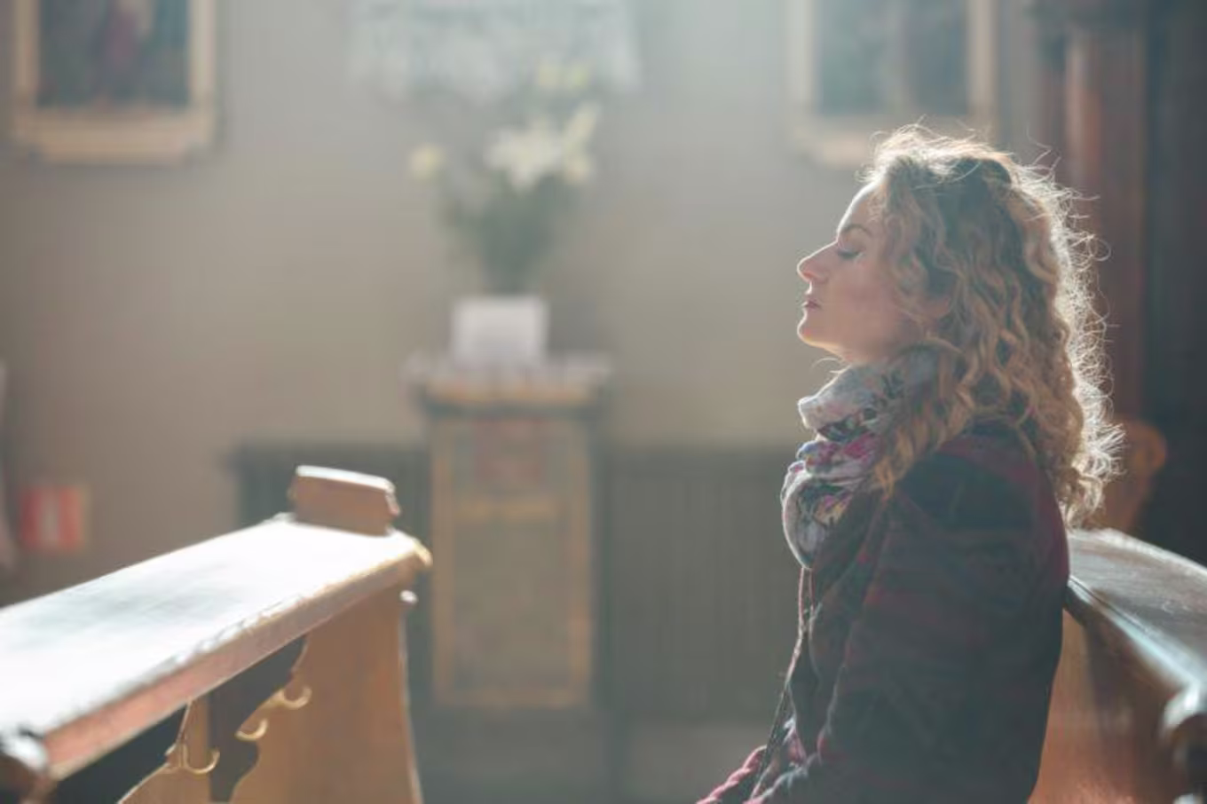 woman praying in a church