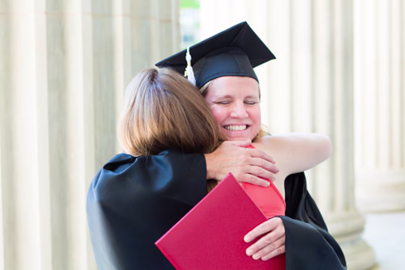 Female doctoral student at graduation after finishing PhD