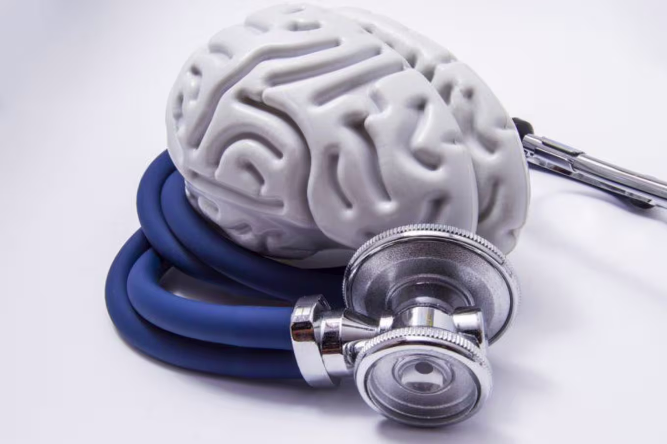 Stethoscope surrounds fake white brain