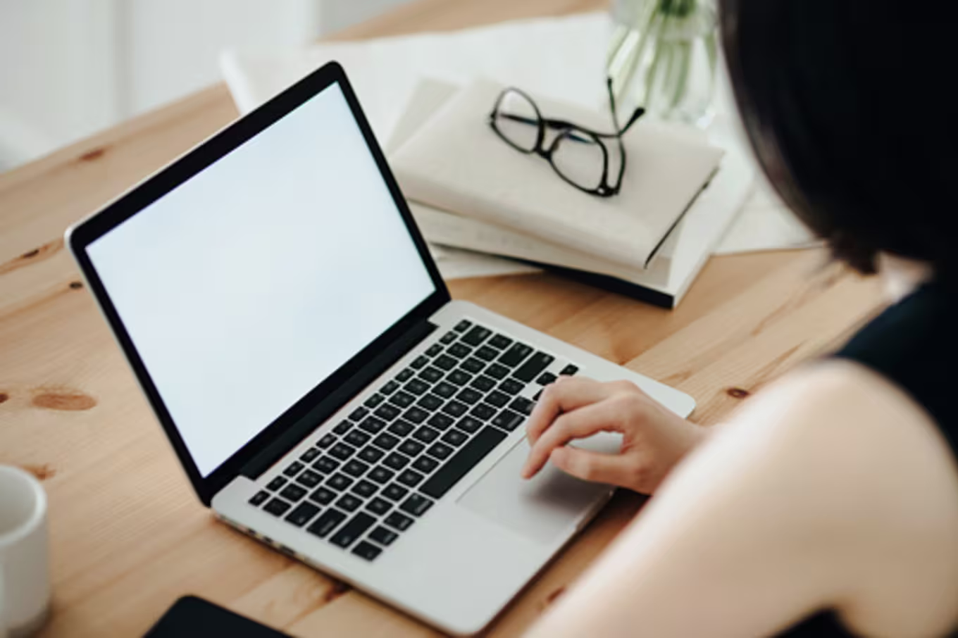 A woman writing an email at her computer
