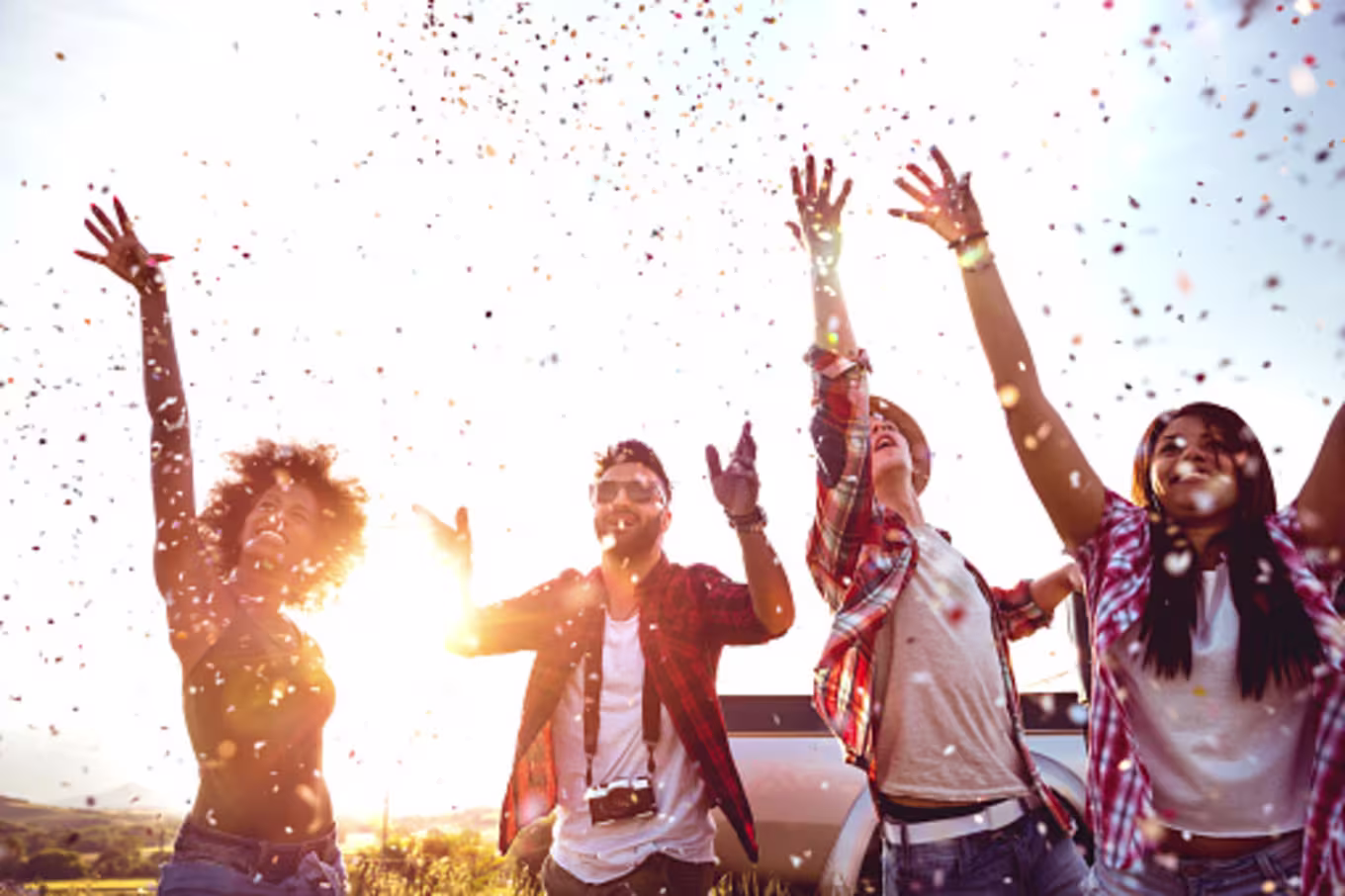 Friends celebrating and throwing confetti