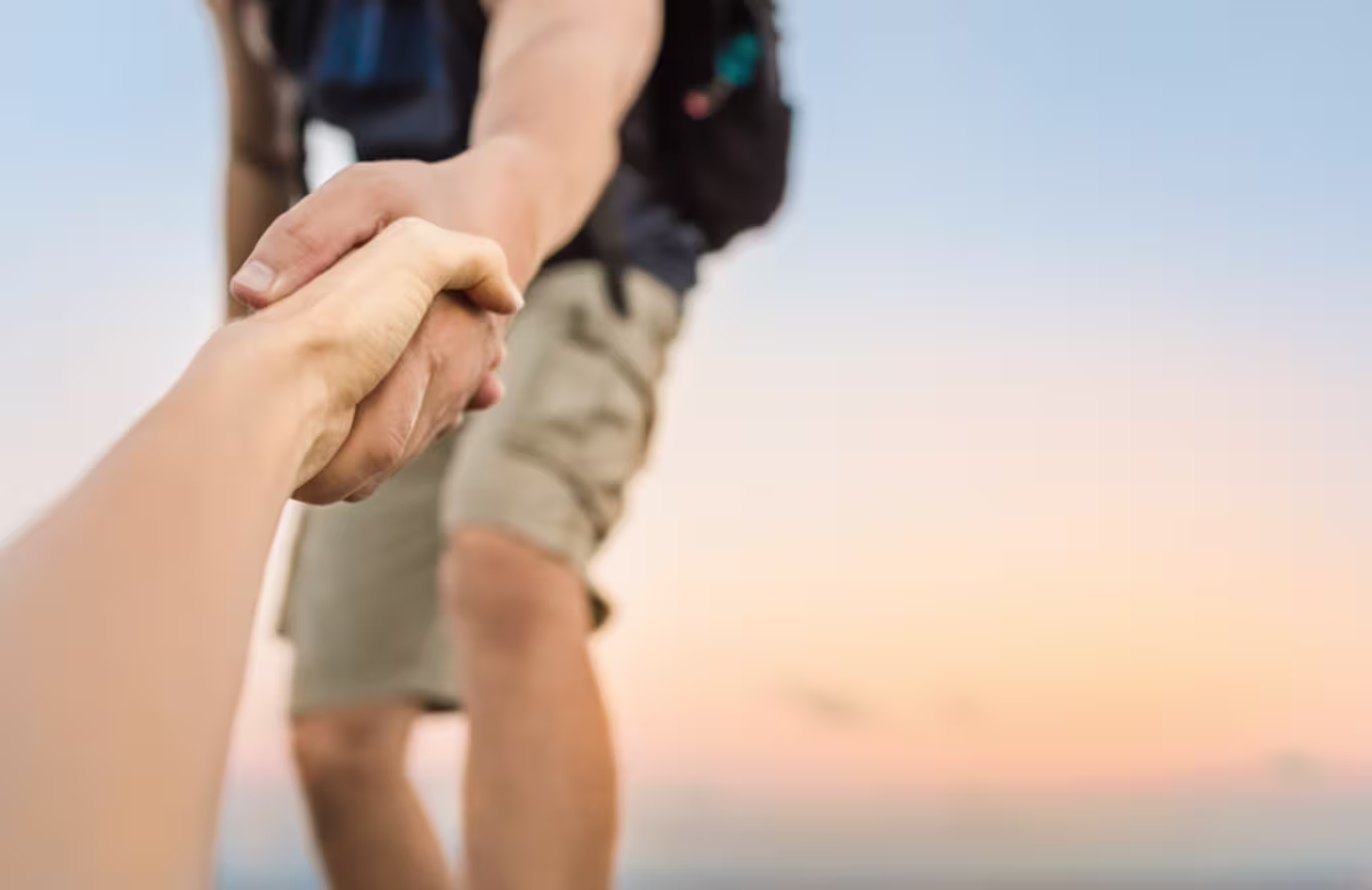 hands pulling someone up