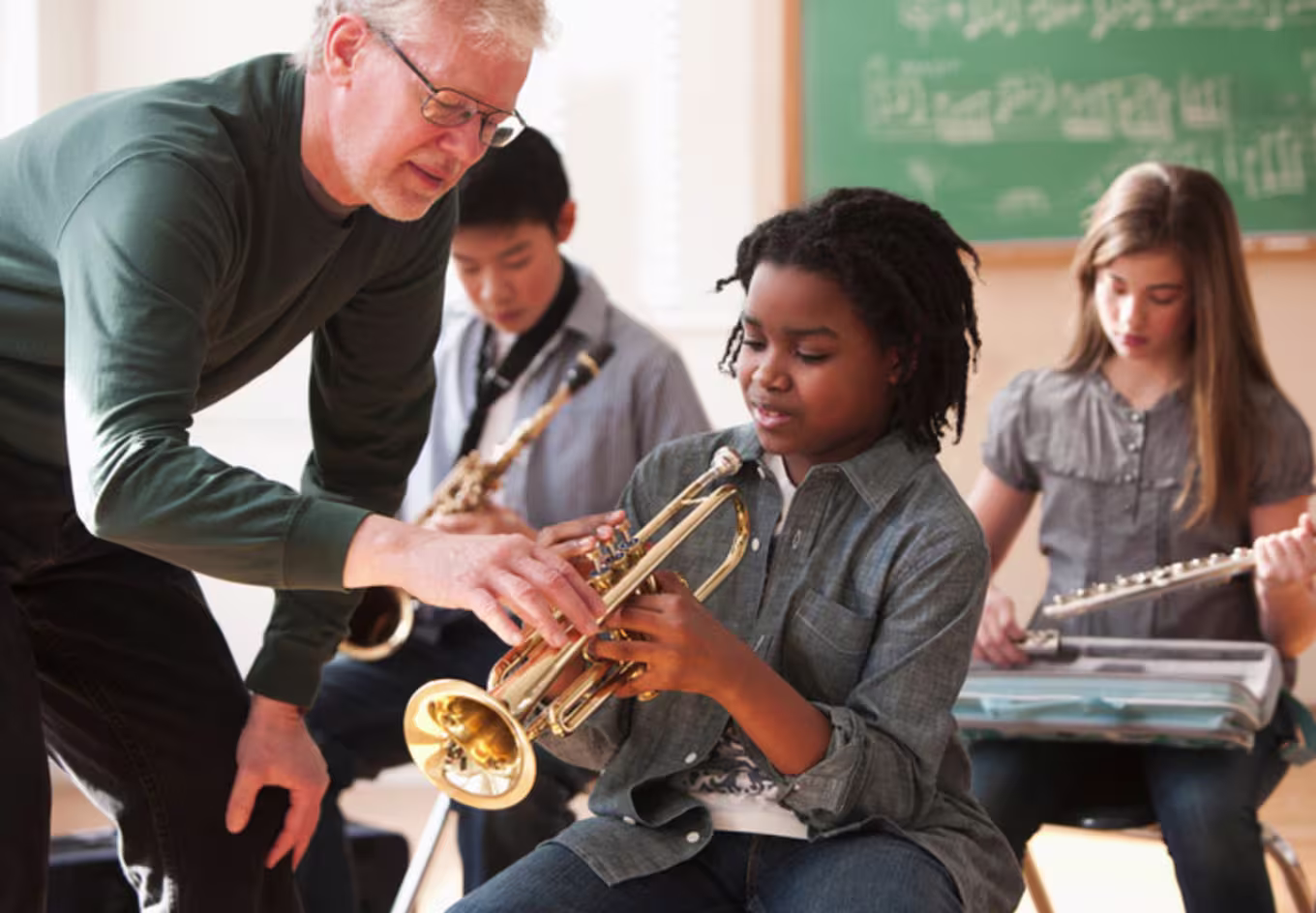 music teacher helping a student
