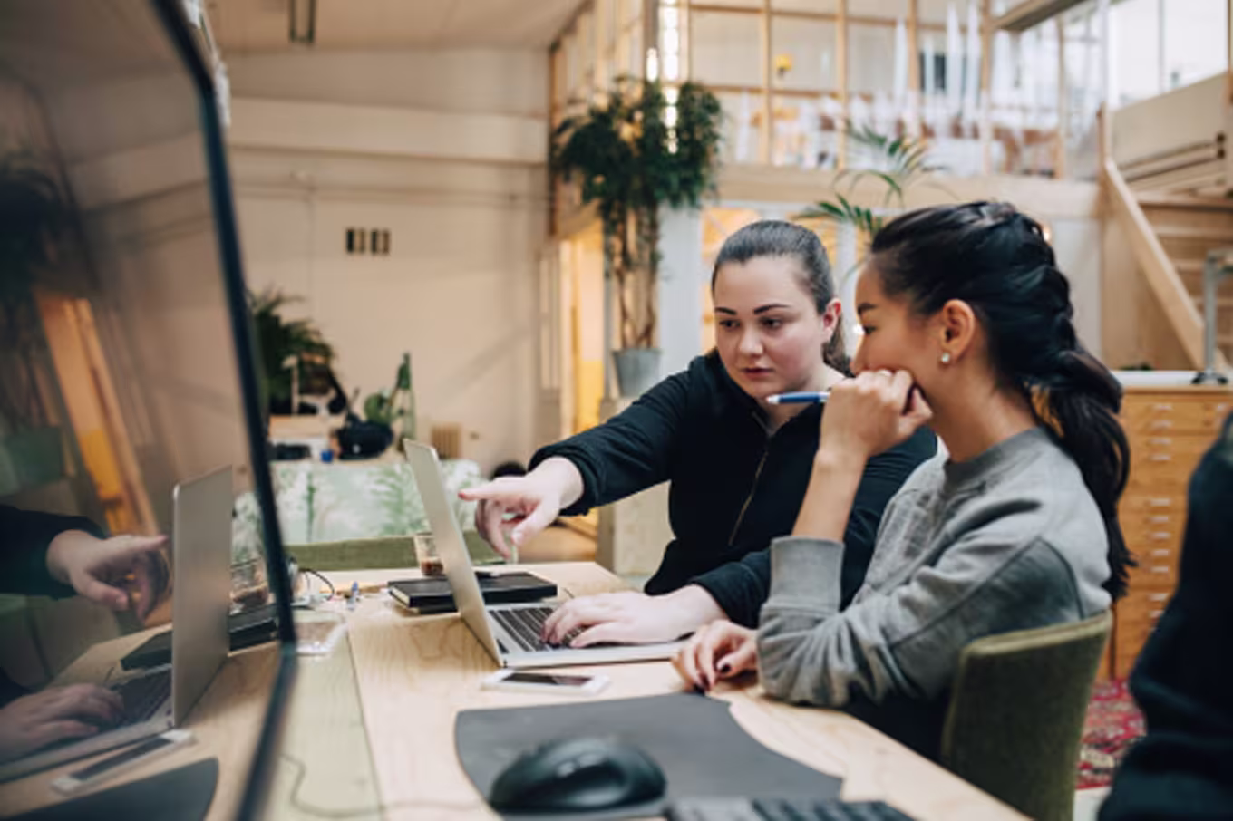 Digital designers collaborating in office