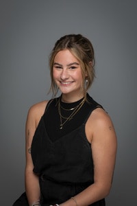 Jacqulyn Trboyevich headshot sitting wearing black.