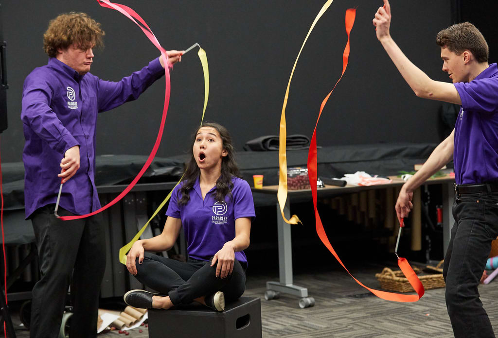 Parables performance by the acting troupe at local churches wearing dark purple GCU branded shirts