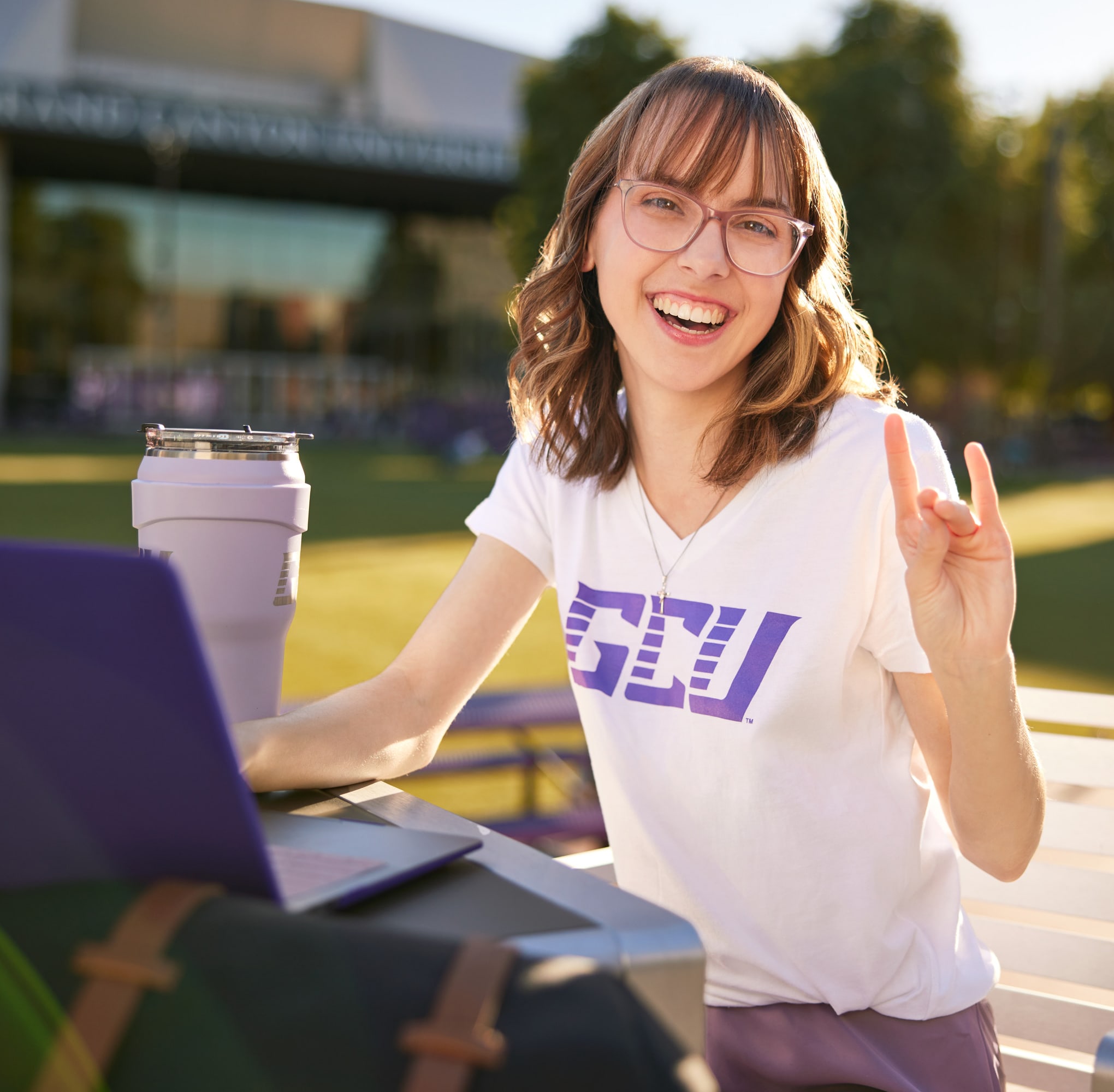 GCU Student showing lopes up hand gesture
