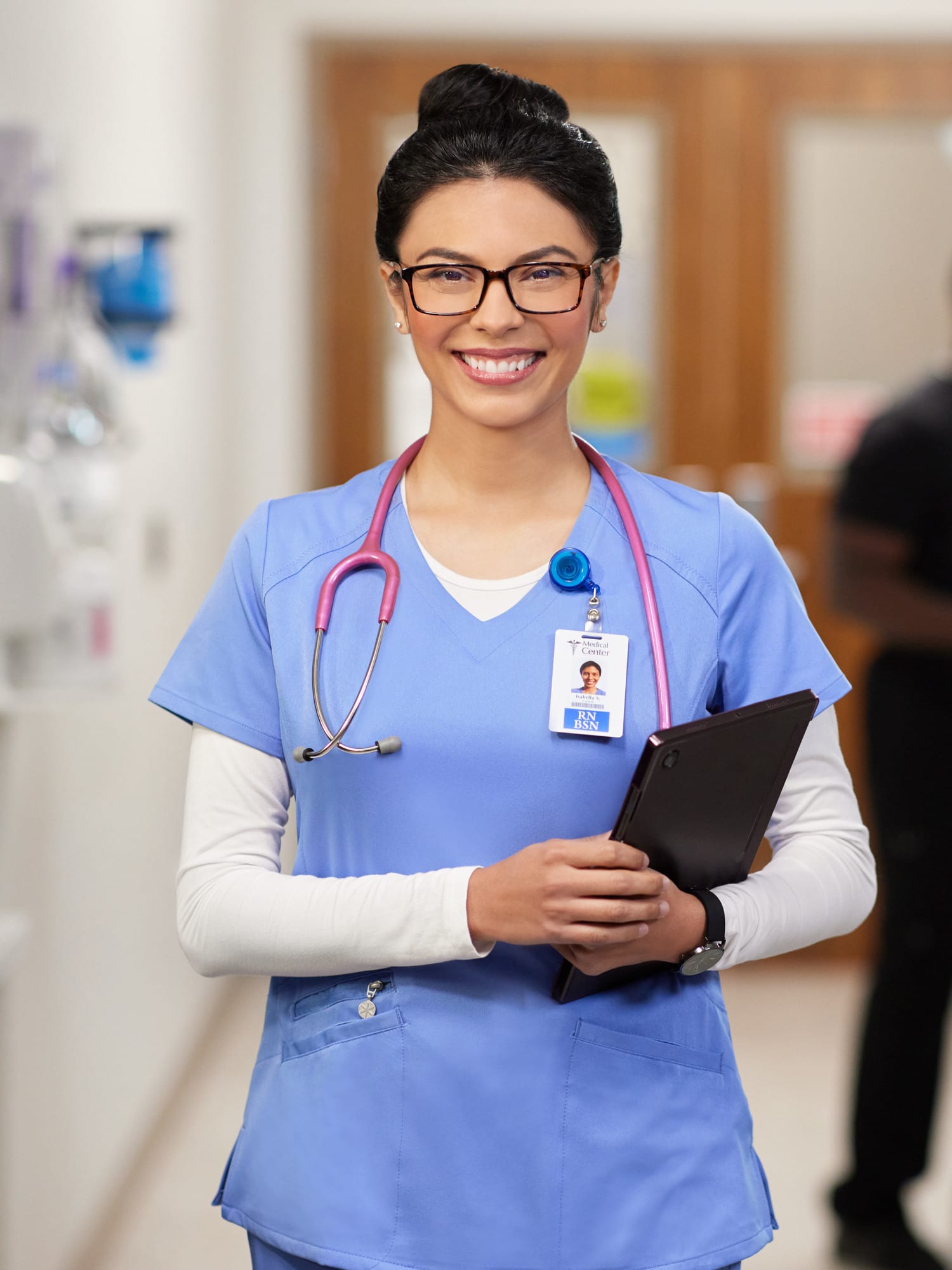 Nurse in hallway smiling