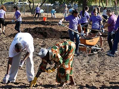 GCU students help Serve the City by cleaning up an area of land