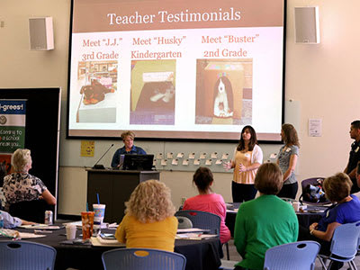 Teachers presenting slideshow