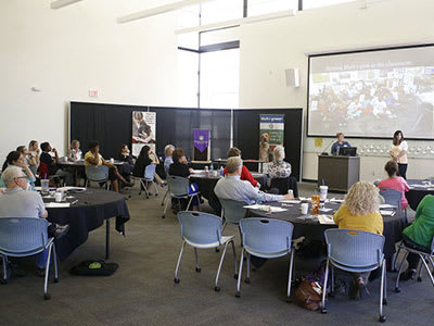 large group of teachers watching presentation