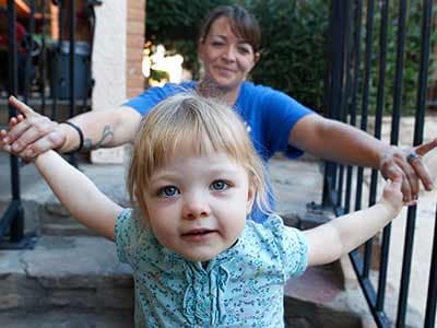 Mother and daughter sitting on some stairs