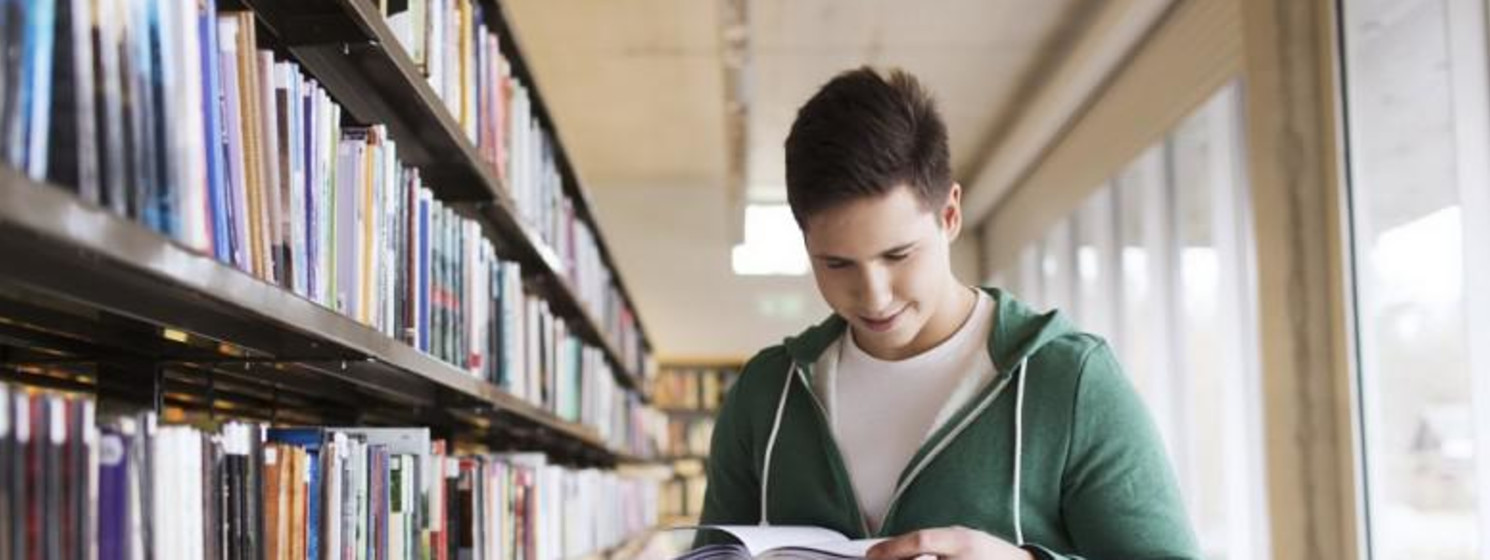 guy at the library reading books
