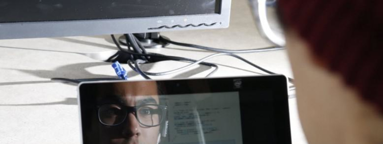 Student Works at laptop